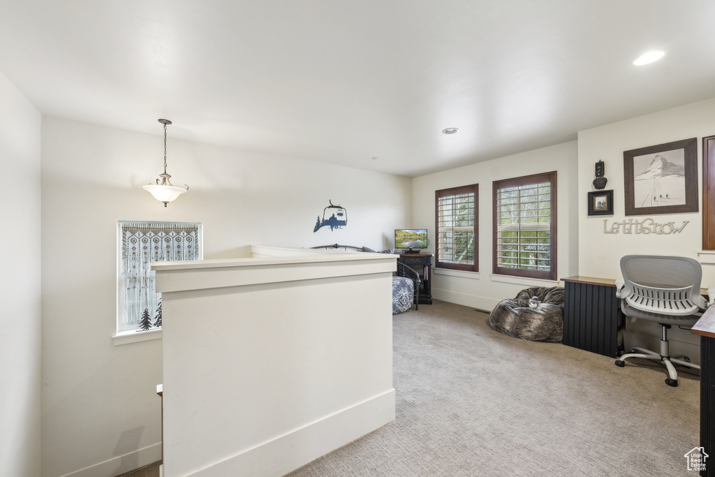 Office area featuring recessed lighting, baseboards, and light carpet