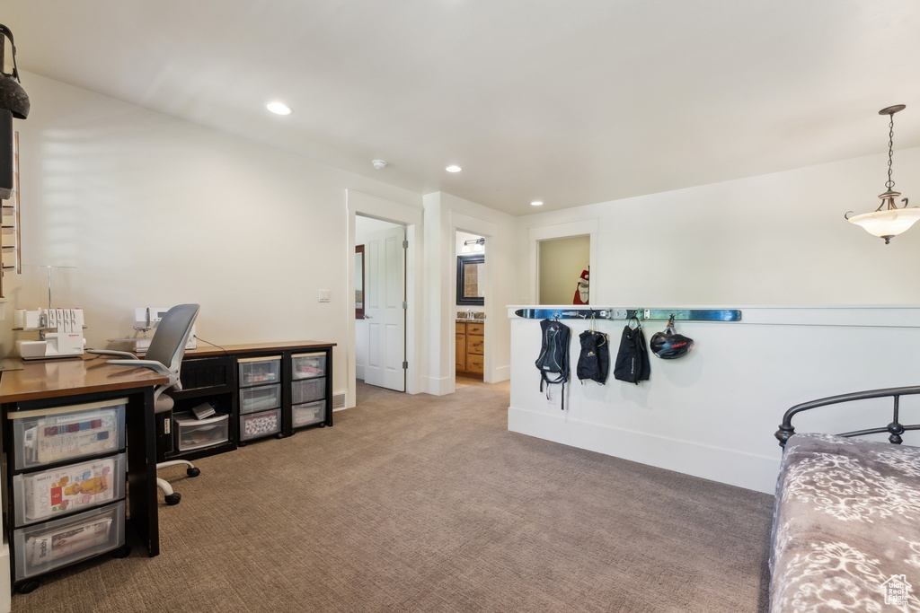 Carpeted office space with recessed lighting