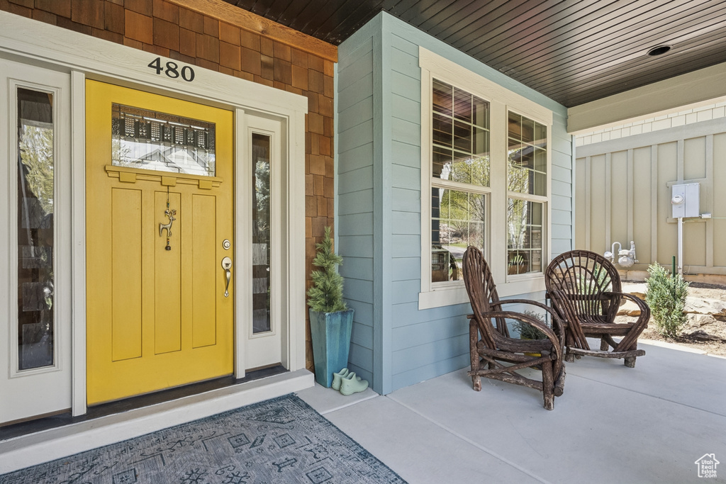 Entrance to property featuring a porch