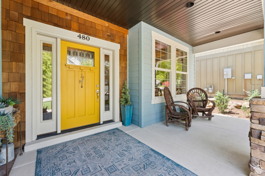 View of exterior entry with covered porch