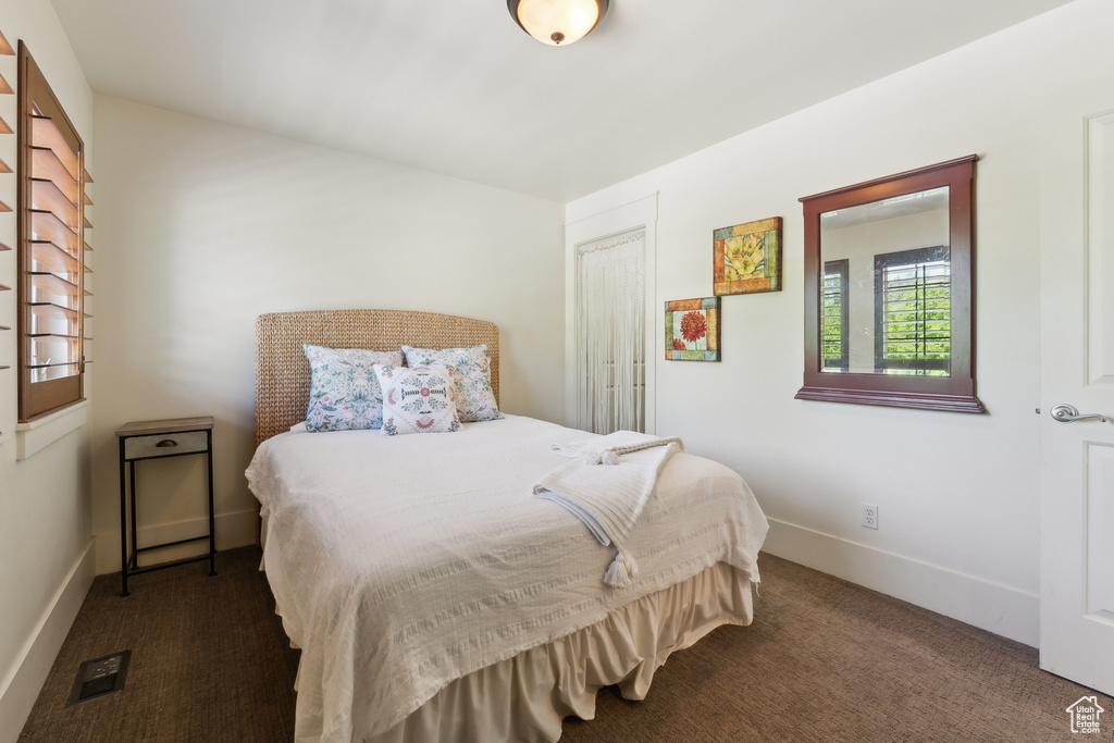 Bedroom with carpet and baseboards
