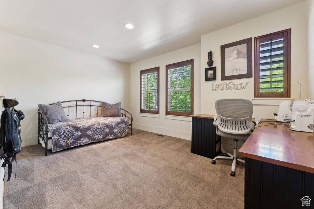 Carpeted bedroom featuring a desk and recessed lighting