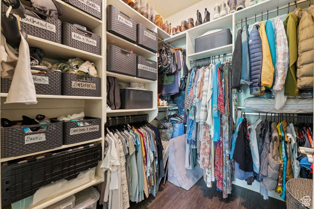 Spacious closet with wood finished floors