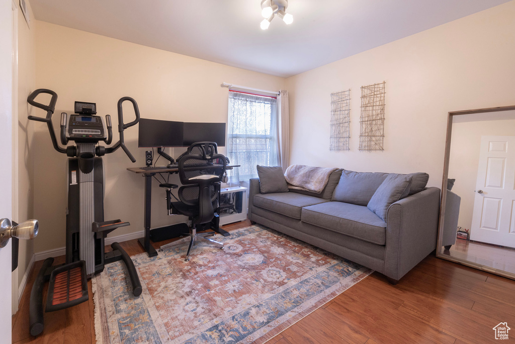 Living room with baseboards and wood finished floors