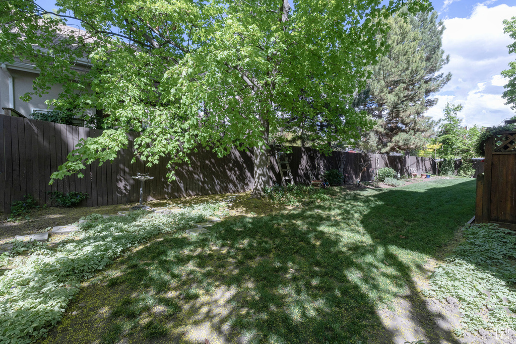 View of yard with a fenced backyard