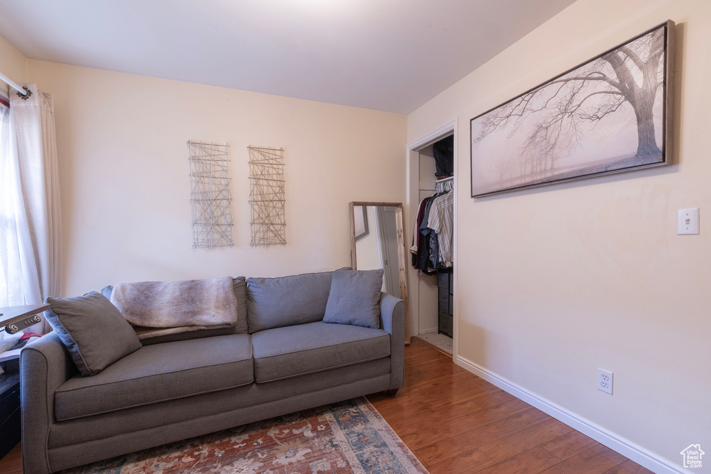 Living room with wood finished floors and baseboards