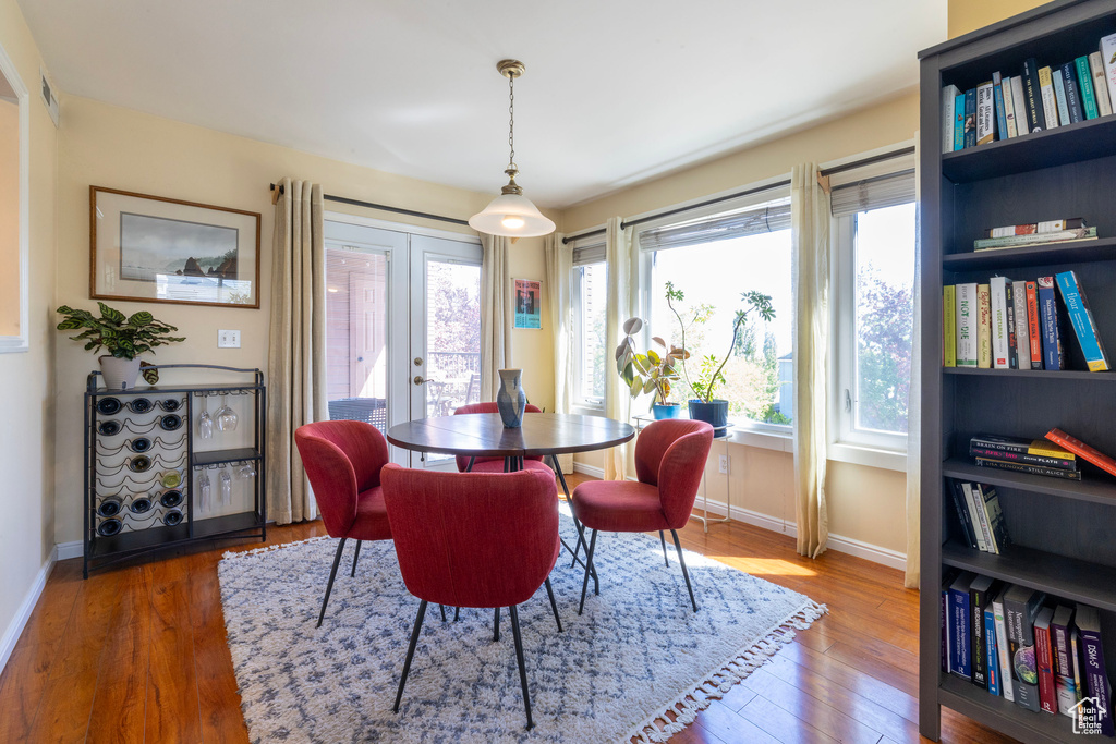Dining space with wood finished floors and baseboards