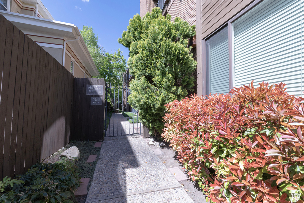 View of home\'s exterior with fence and a gate