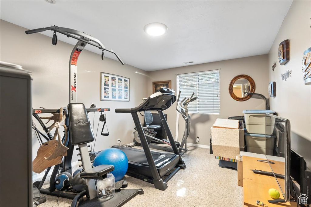 Workout room featuring baseboards