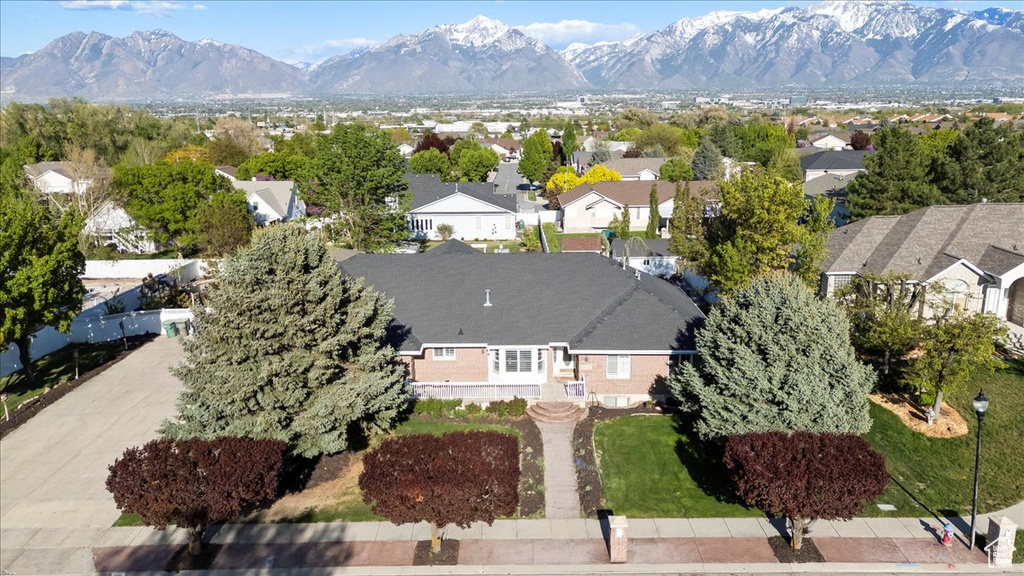 Drone / aerial view with a residential view and a mountain view