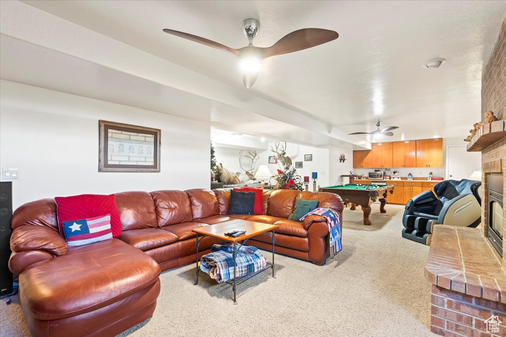 Living area featuring carpet floors, a ceiling fan, and pool table
