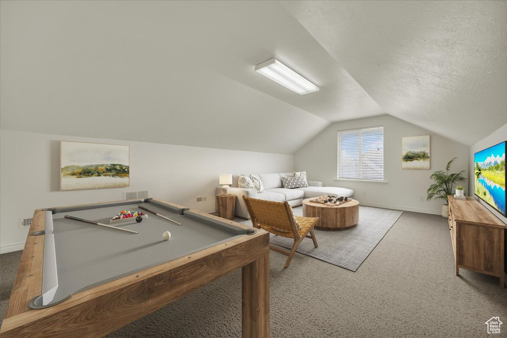 Rec room featuring carpet floors, lofted ceiling, and baseboards