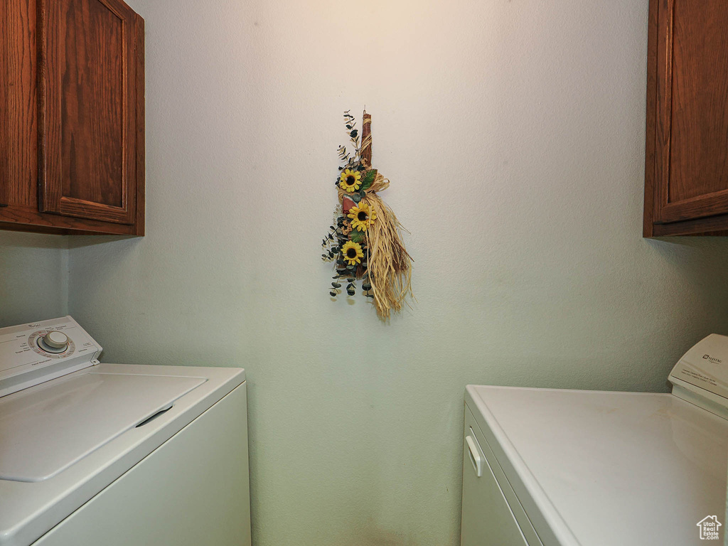 Laundry room featuring cabinet space and washing machine and dryer