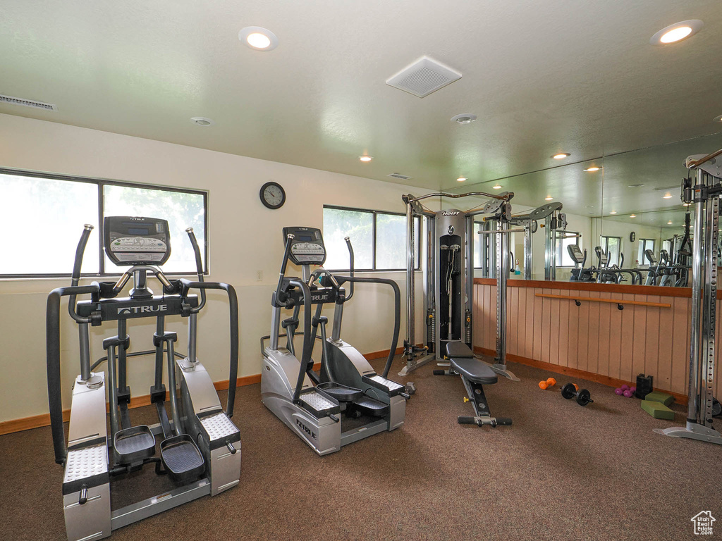 Workout area with recessed lighting, baseboards, and visible vents