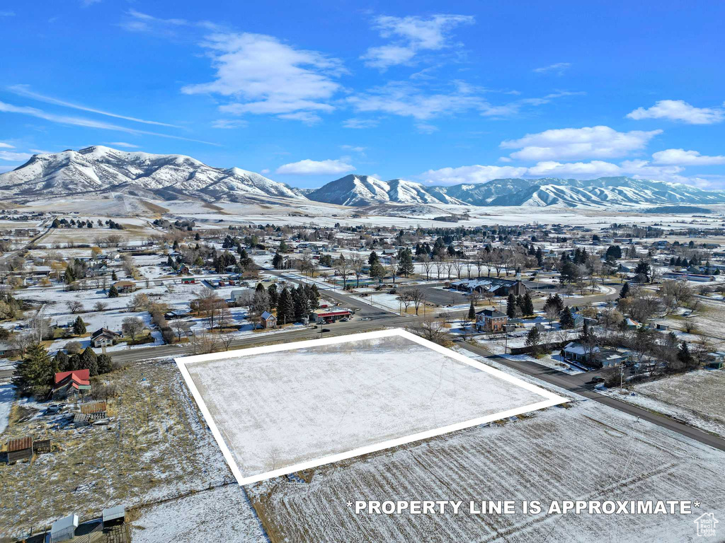 Drone / aerial view featuring a residential view and a mountain view