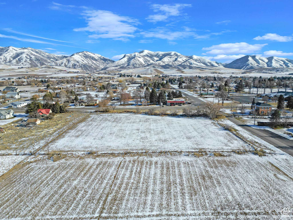 Snowy aerial view featuring a mountain view