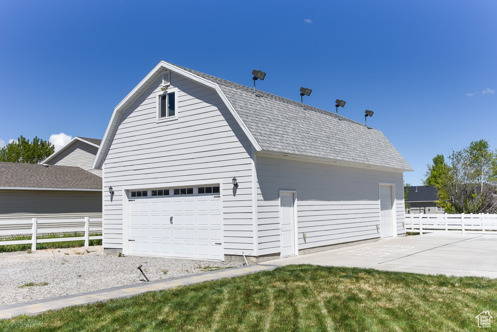 Garage featuring fence