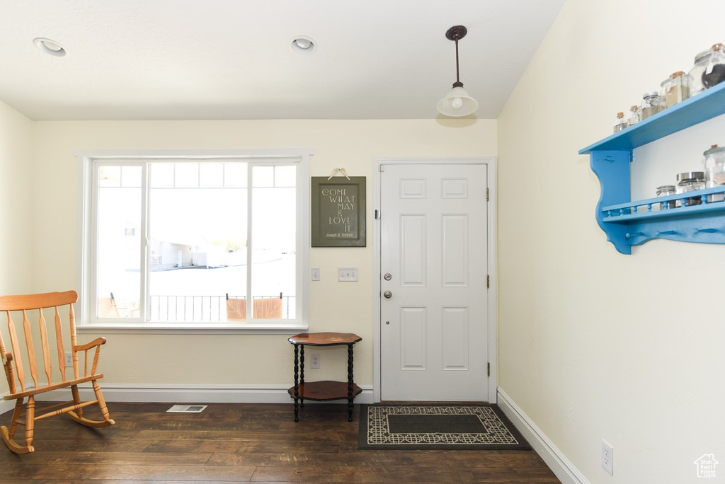 Foyer entrance featuring dark wood-type flooring, recessed lighting, baseboards, and visible vents