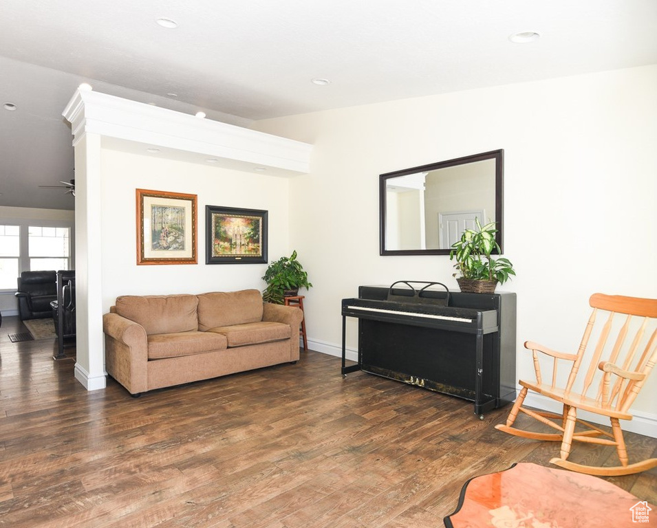 Sitting room with recessed lighting, baseboards, and wood finished floors