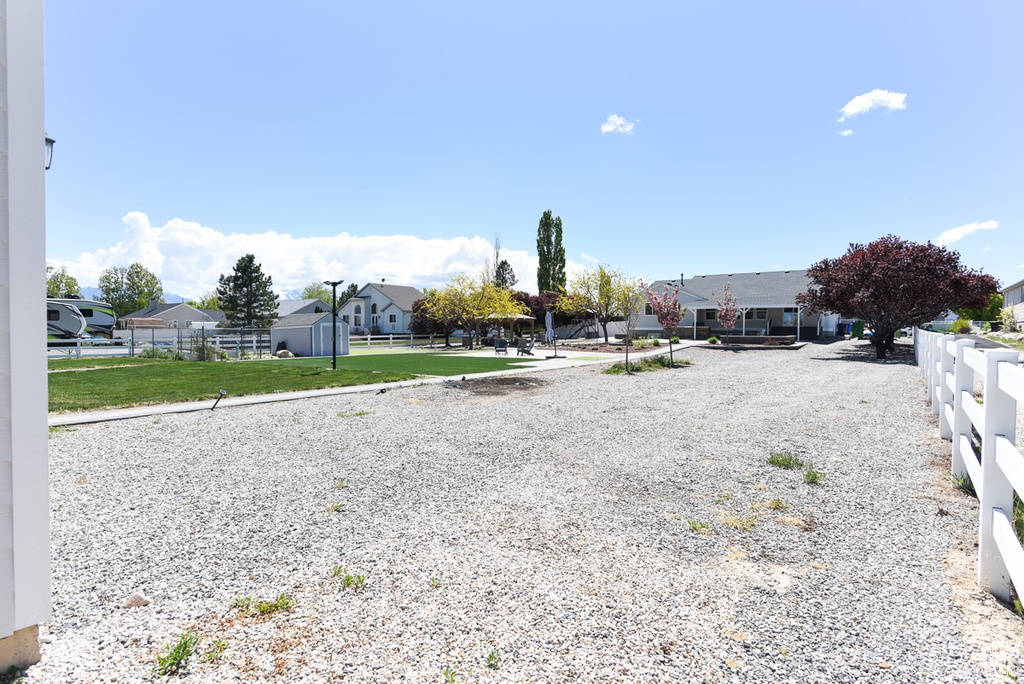 View of yard with fence and a residential view