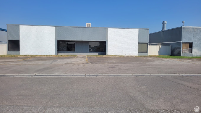 View of outbuilding with uncovered parking