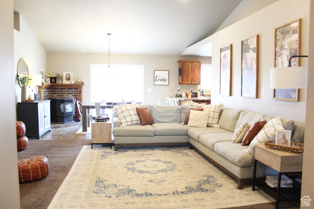 Living room with lofted ceiling and carpet floors