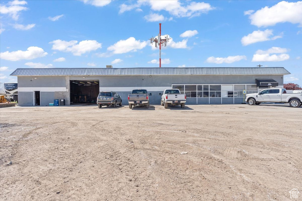 View of property with uncovered parking