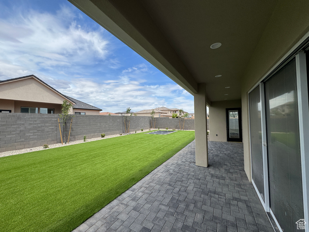 View of yard featuring a patio and a fenced backyard