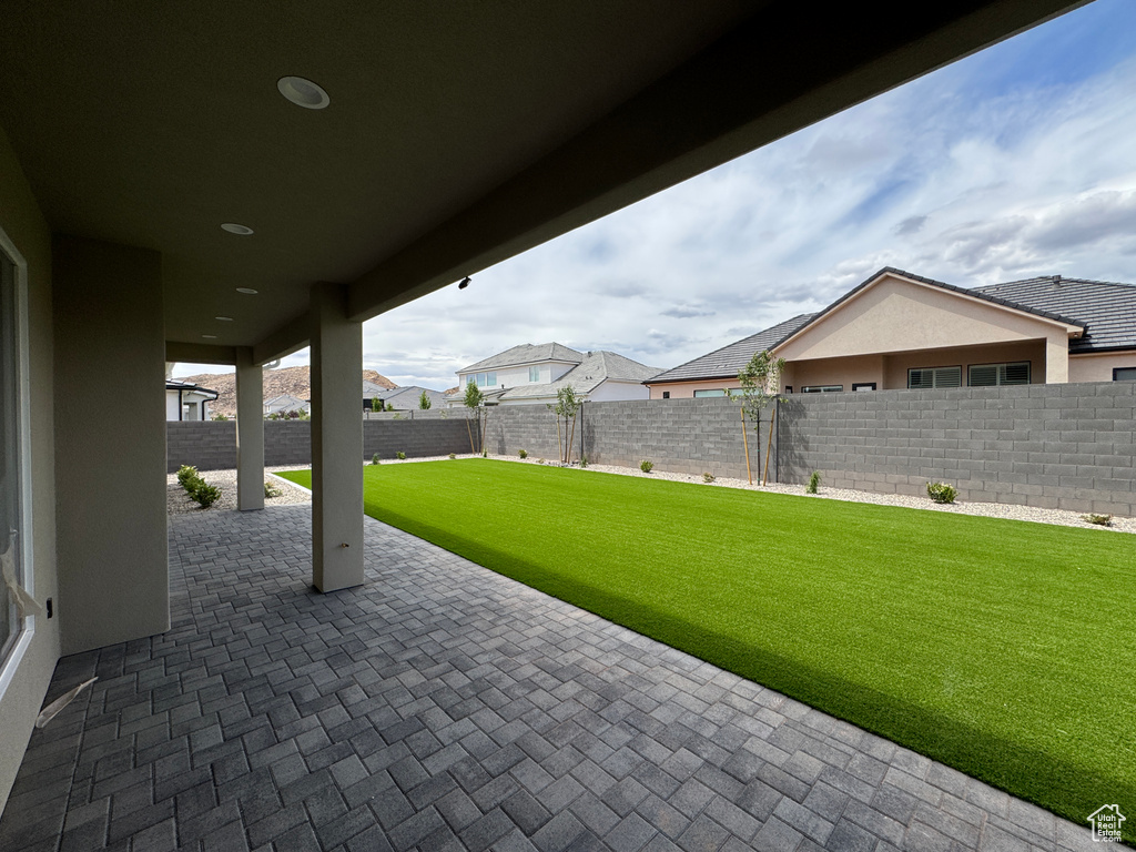View of patio featuring a fenced backyard