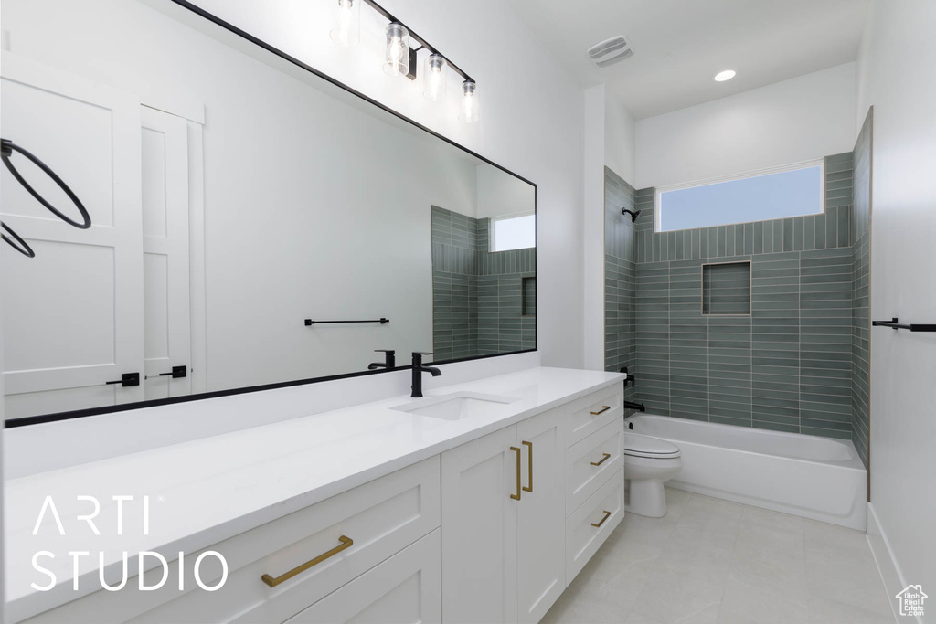 Full bathroom with toilet, tile patterned flooring, vanity, shower / bathtub combination, and recessed lighting