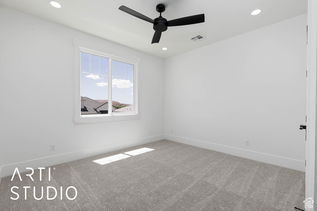 Spare room featuring a ceiling fan, carpet, baseboards, and recessed lighting