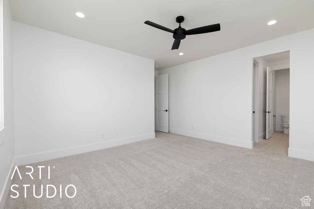 Unfurnished room featuring light carpet, ceiling fan, recessed lighting, and baseboards