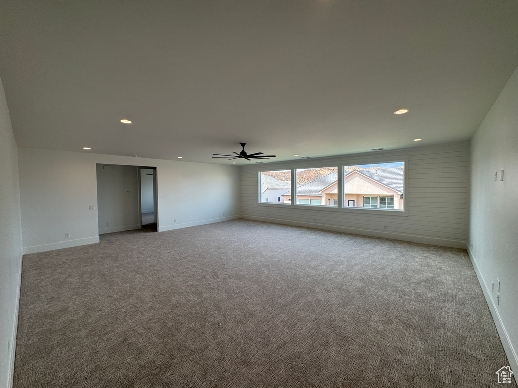 Unfurnished room with recessed lighting, carpet, ceiling fan, and baseboards