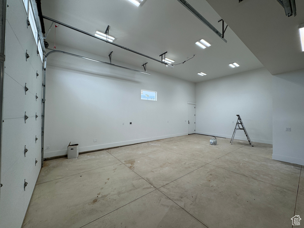 Garage featuring baseboards
