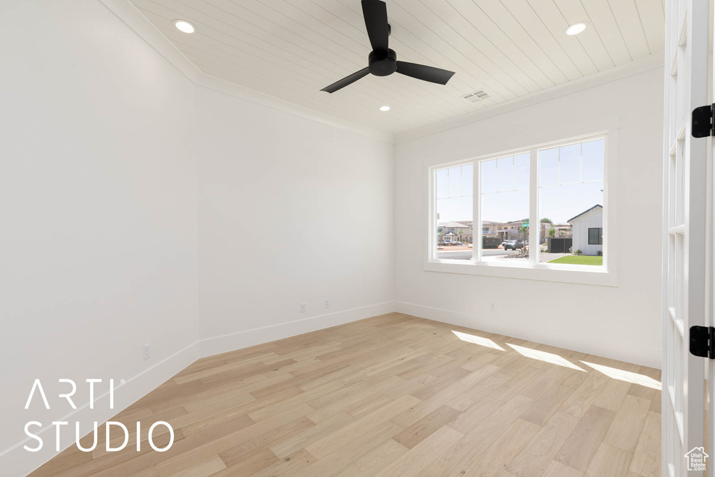Spare room featuring ornamental molding, ceiling fan, recessed lighting, light wood-style flooring, and wooden ceiling