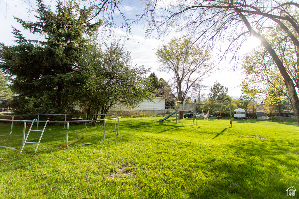 View of yard featuring fence