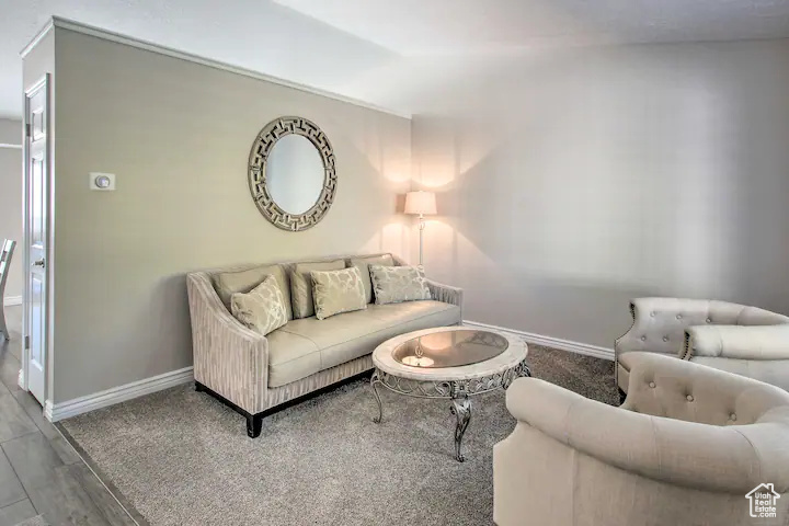 Living room with baseboards and wood finished floors