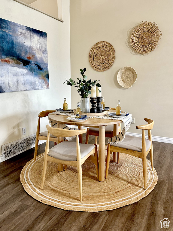 Dining room with wood finished floors and baseboards