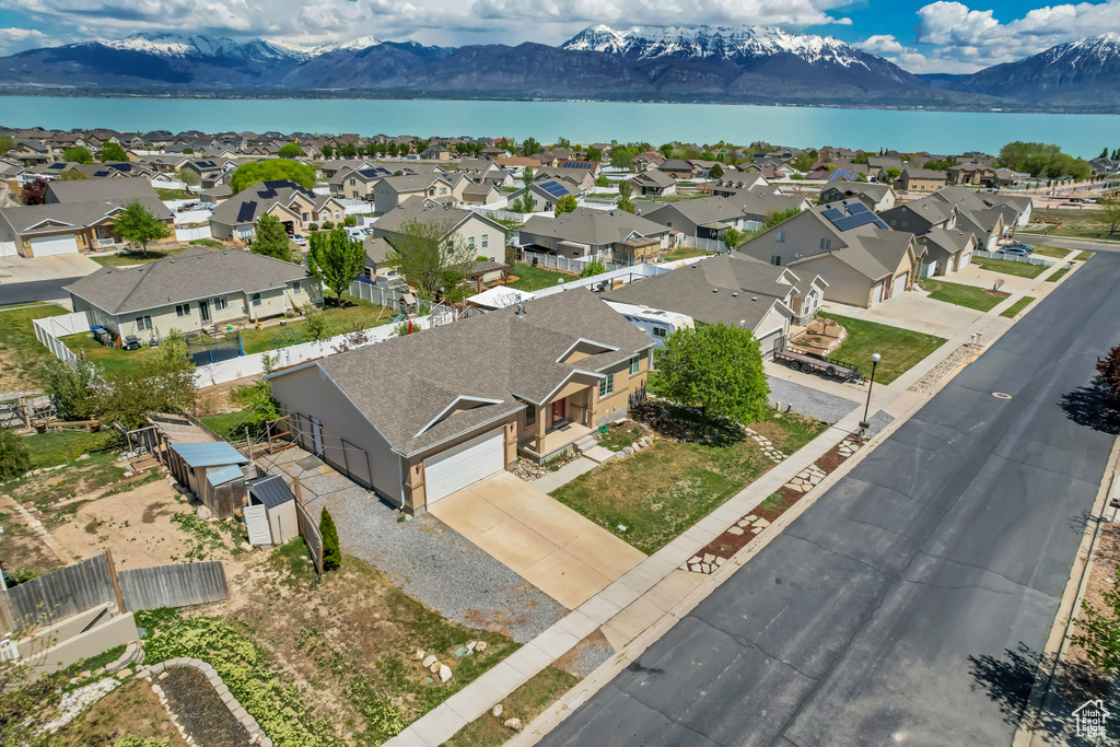 Birds eye view of property with a residential view and a water and mountain view
