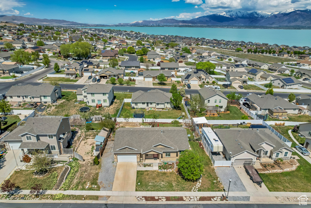 Birds eye view of property with a residential view and a water and mountain view