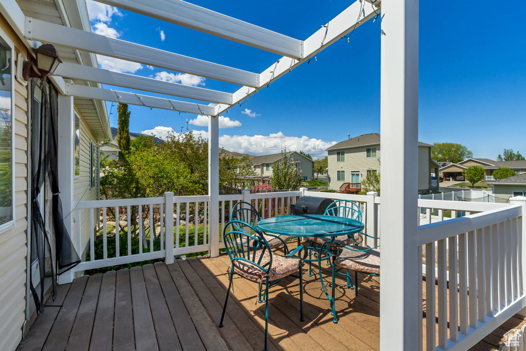 Deck featuring a residential view and outdoor dining space