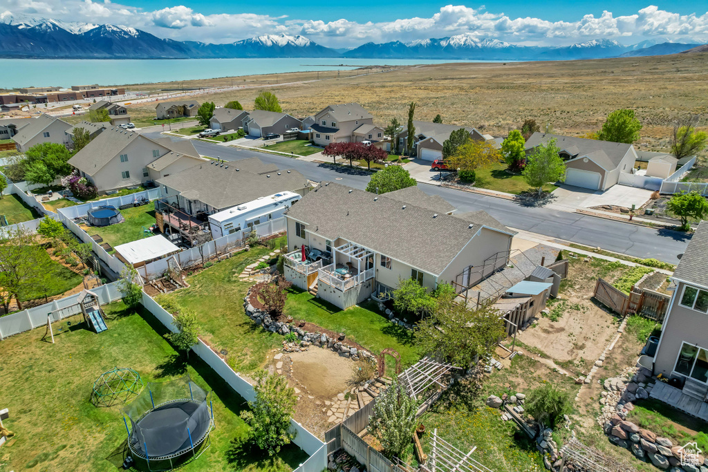 Drone / aerial view featuring a residential view and a water and mountain view