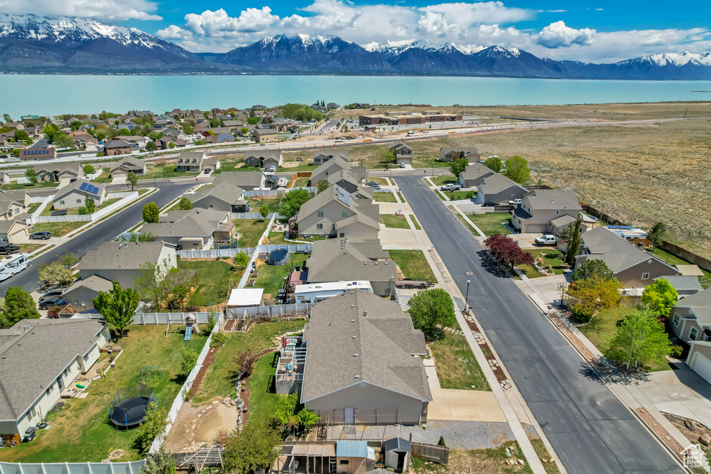 Drone / aerial view with a residential view and a water and mountain view