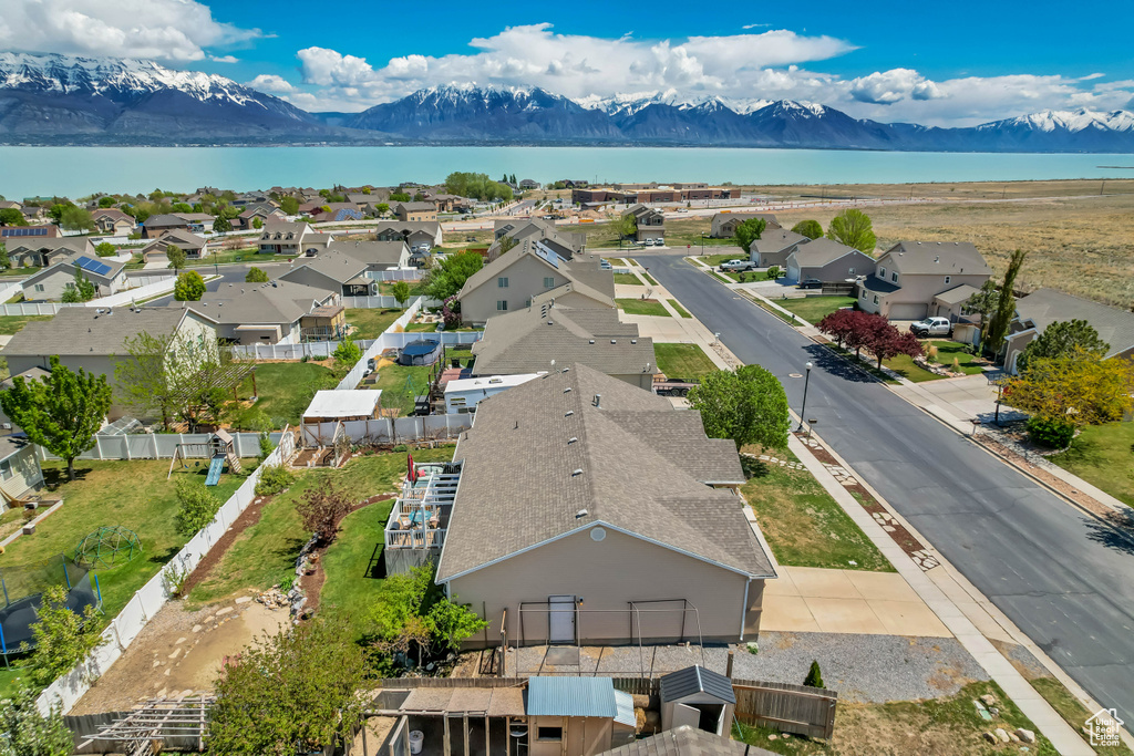 Birds eye view of property with a residential view and a water and mountain view
