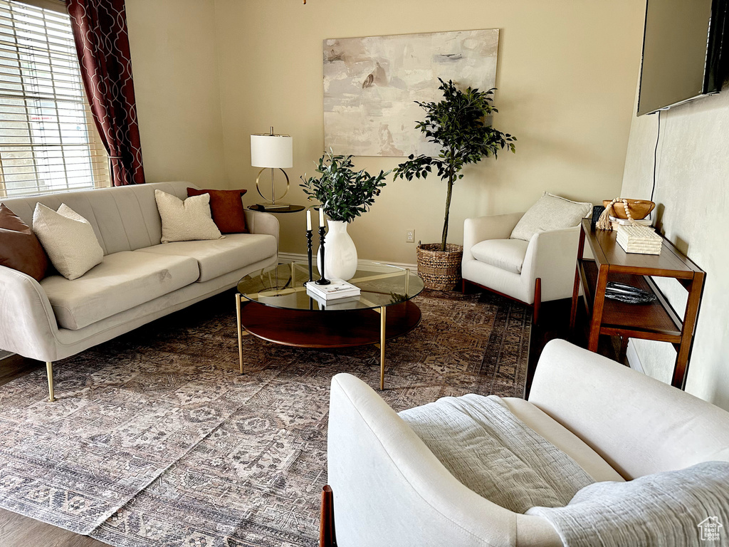 Living area featuring baseboards