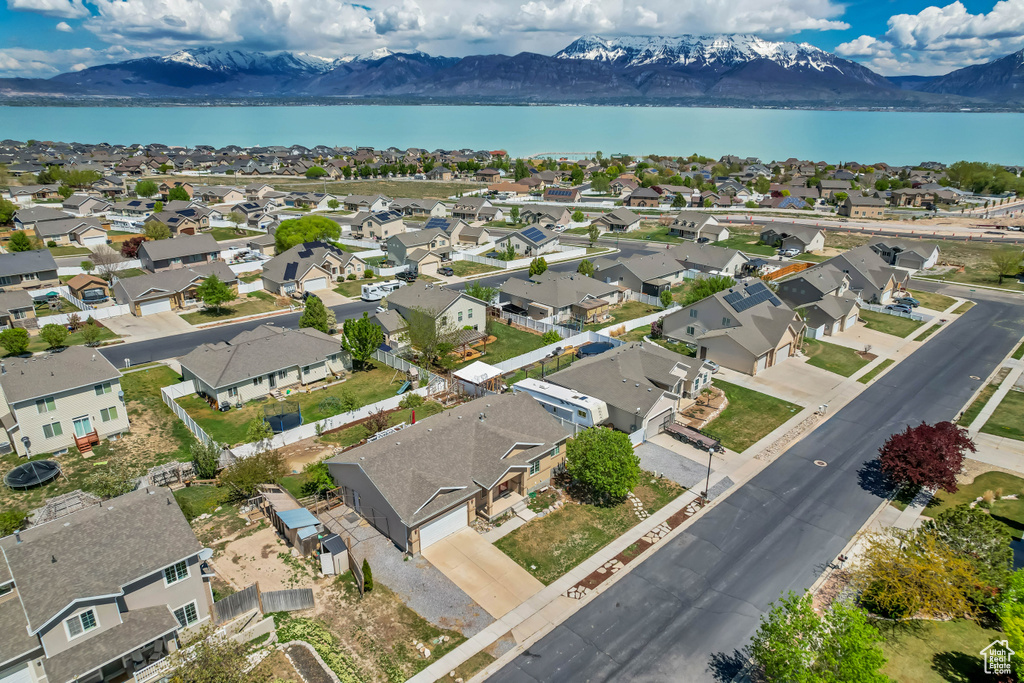 Drone / aerial view with a residential view and a water and mountain view