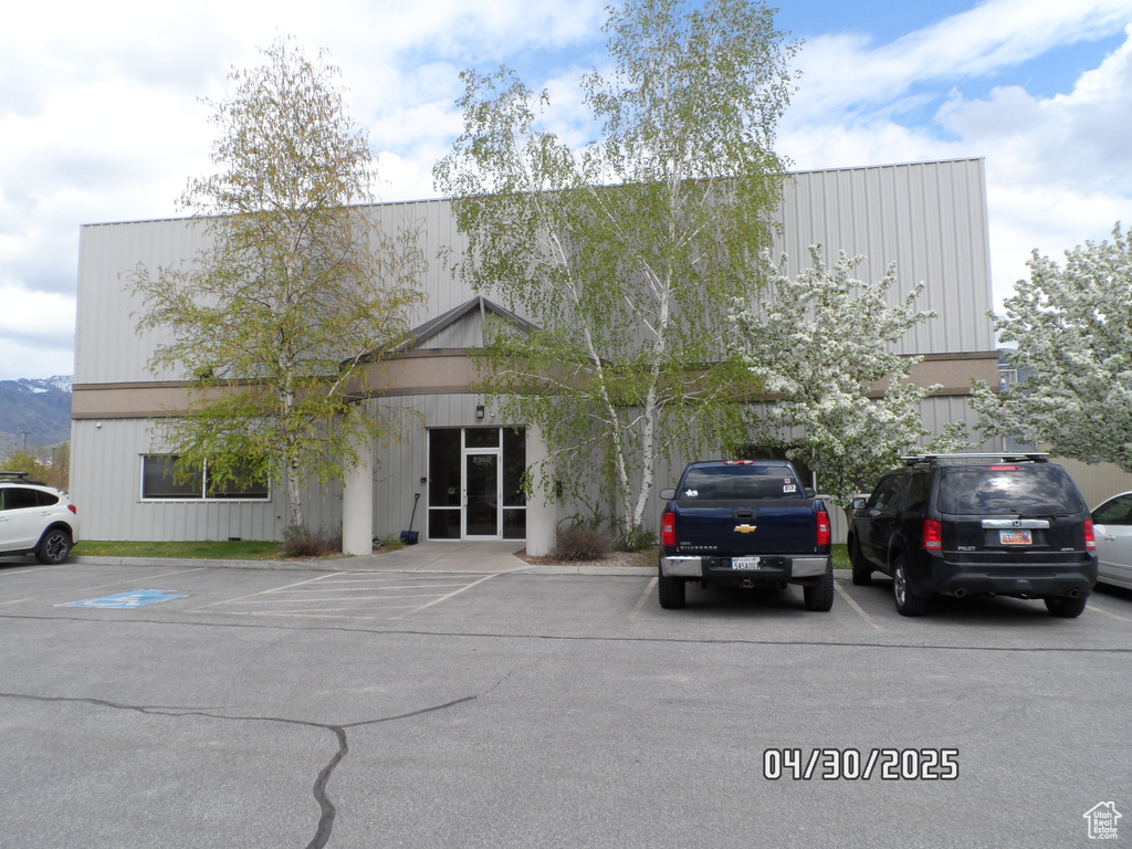 View of front of house featuring uncovered parking