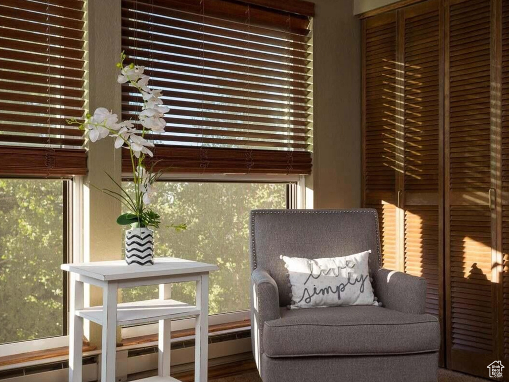 Sitting room with a baseboard radiator