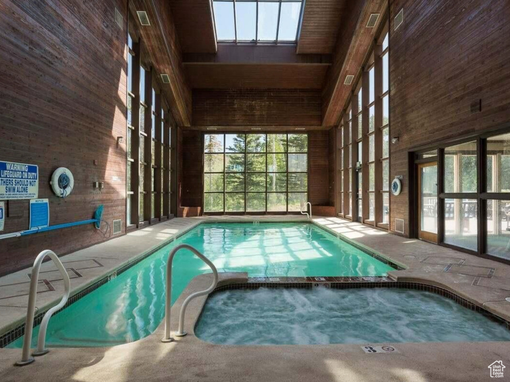 View of swimming pool with a pool with connected hot tub