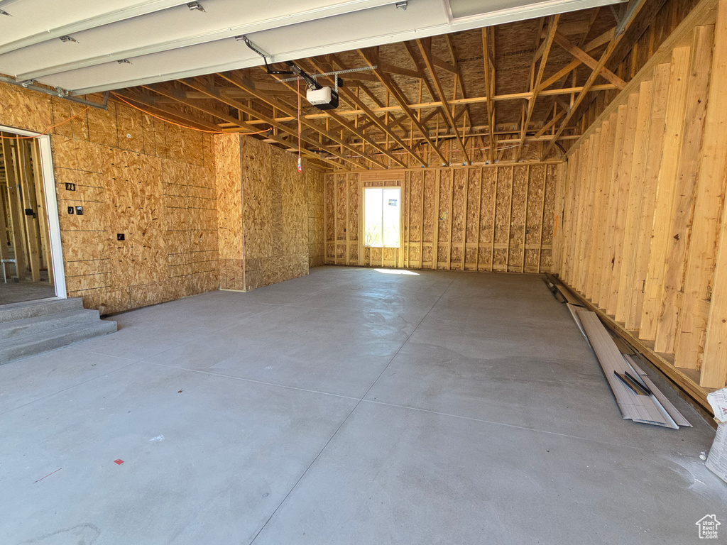 Garage featuring a garage door opener
